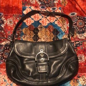 Coach small Soho black leather buckle bag.